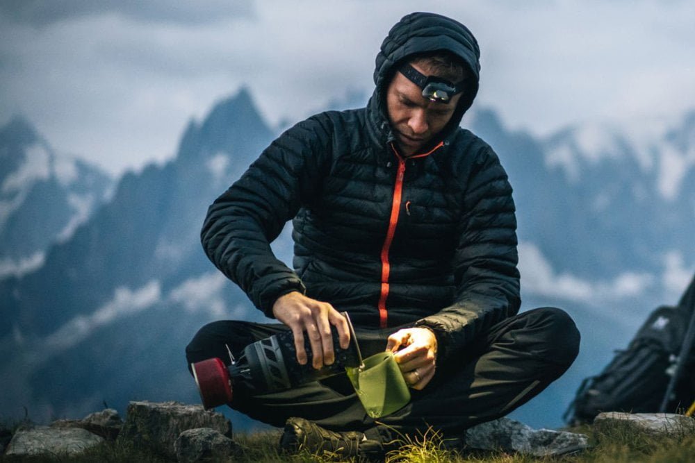 Chef cooking on camping stove with high CRI headlamp cooking outdoors with high CRI light